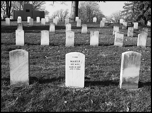 Tombstones with one stating: Mary P, His Wife